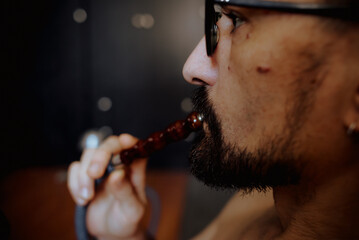 man smoking cigarette