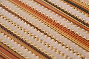 Uncooked italian pasta, colored spaghetti and mafalde