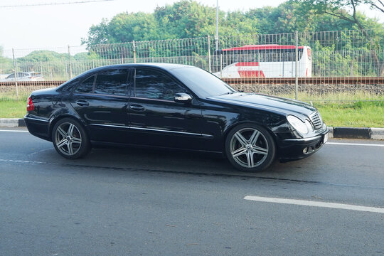 luxury sedan Mercedes E Class,   on the road at Cengkareng, Banten, Indonesia       