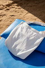 blank shopper handbag mockup on lounge on sandy beach