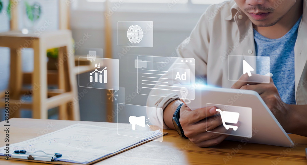 Aufkleber digital marketing concept with businessman using tablets creating online adverts to increase sales. 