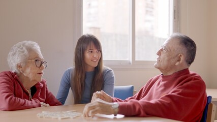 Grandfather talking with the family during a visit in geriatric