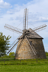 Old Dutch windmill. Built in 1880-1885 in Szwarszowice. Standing on a green meadow with blue sky and clouds. Stary holenderski wiatrak. Zbudowany w latach 1880-1885 w Szwarszowicach. Stojąc na zielone © jarizPJ