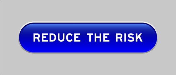 Blue color capsule shape button with word reduce the risk on gray background