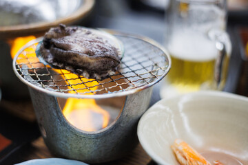 Grilled abalone dinner in Japan