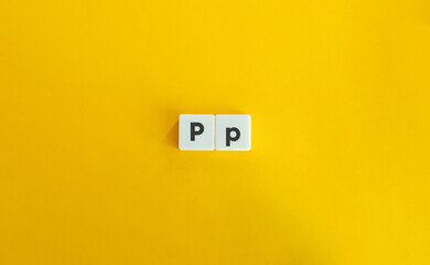 Capital and Small Letter P. Uppercase and Lowercase Letter. Concept of Learning Alphabet. Text on Block Letter Tiles against Yellow Orange Background.