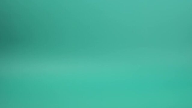 Unrecognizable researcher's hand with latex glove holding empty titration flask during laboratory experiment.