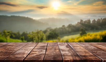 table background of free space for your decoration and blurred landscape of mountains.Blue sky with sun light and green small leaves.