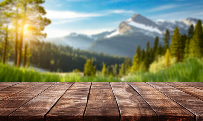 table background of free space for your decoration and blurred landscape of mountains.Blue sky with sun light and green small leaves.