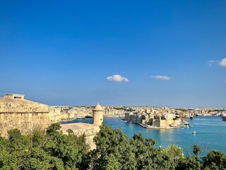 aerial view of the bay of valletta in malta with the citadel and its fortresses on a sunny summer day
