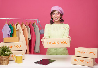 Young asian woman startup small business freelance seller clothing with parcel box and tablet...