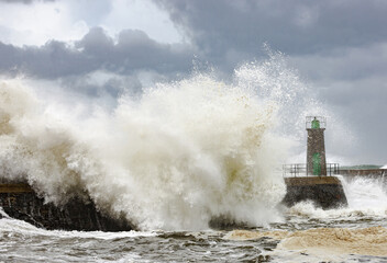 Impressive huge waves hitting the port of Viavelez in Asturias during a storm in the Cantabrian Sea