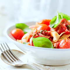 Pappardelle Pasta with Vegetables and fresh Basil on bright wooden Background