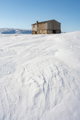 An abandoned old house on an arctic treeless uplands on a bright winter day, Berlev&aring;g, Northern Norway