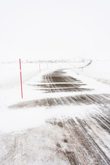 Poor visibility on the road on a windy winter day due to drifting snow, Tana, Northern Norway