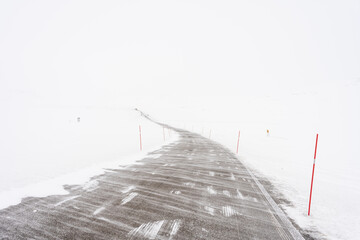 Poor visibility on the road on a windy winter day due to drifting snow, Tana, Northern Norway