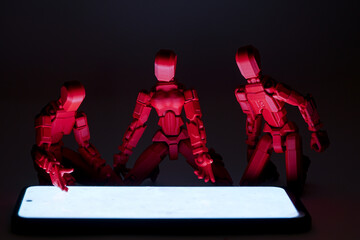 Concept photo of people's addiction to social networks. Figures of people with a telephone

