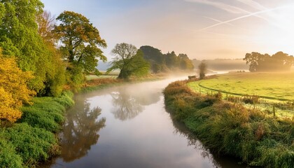 Low lying morning fog over a small country river in early morning light
