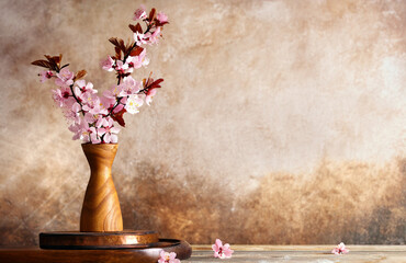 blooming sakura branches in a vase for interior decoration © Olga Kriger