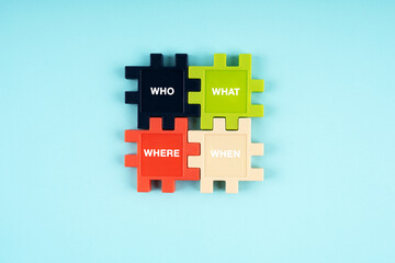 Fototapeta premium Who, what, where and when text on jigsaw puzzle pieces on blue background