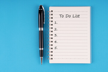 To do list text on notepad on blue background