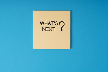 What's next text on adhesive note blue background