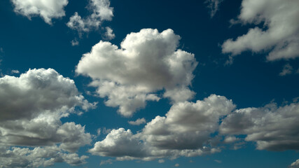 Blue Heaven and white clouds. Sky clouds background. White cloudy on Heaven with soft sun light. Clouds on pastel blue sky background. Sky Landscape Background. Sky Clouds Wallpaper.