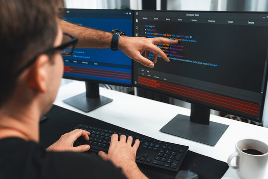 IT developers creating online software development information on screen laptop with coding program in data of application and website. Technical engineer coder on safety program concept. Sellable.