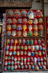 Fototapeta premium Traditional handcrafted masks and souvenirs for sale in street shop of Kathmandu, Nepal