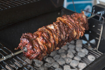 Middle-Eastern Doner Kebab Being Expertly Crafted, Sizzling on a Rotisserie Grill