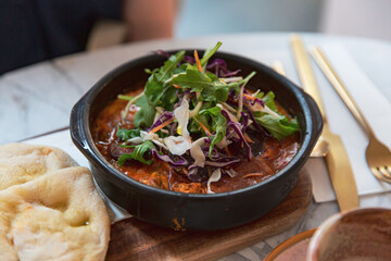 Spanish Hot Pot with Braised Chorizo, Capsicum, and Beans, Served with Toasted Turkish Bread for a...