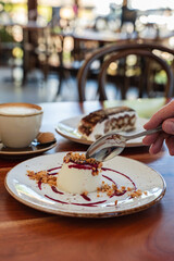 Man eating panna cotta dessert at an Italian Restaurant in Australia