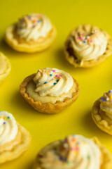 Group photo of mini lemon pies with cream.