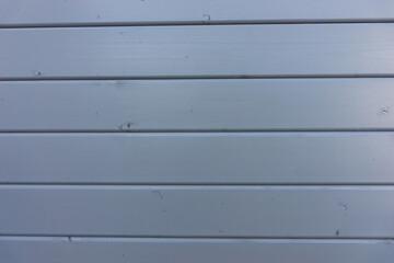 Light gray wooden panel background