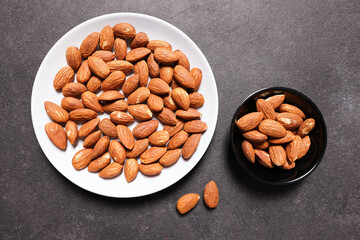 A collection of almonds placed in two containers