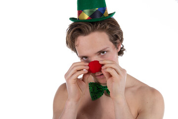 A young attractive guy in a clown costume. White background.
