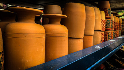 Handmade ceramic clay-based earthenware used for drinking and cooking. Realistic clay kitchenware...