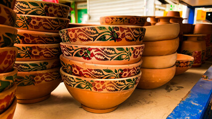 Handmade ceramic clay-based earthenware used for drinking and cooking. Realistic clay kitchenware...