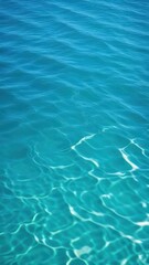 Obraz premium Close view of clear beautiful blue flowing water in swimming pool. Slow motion vertical video. Water surface. Travel and vacation concept. Summer