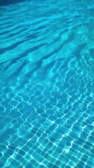 Obraz premium Close view of clear beautiful blue flowing water in swimming pool. Slow motion vertical video. Water surface. Travel and vacation concept. Summer