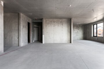 interior of the apartment without decoration in gray colors. rough finish