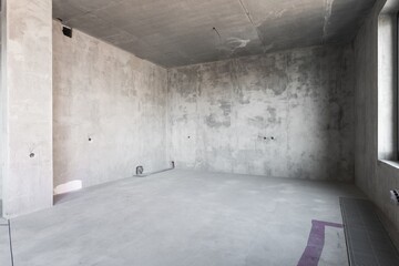 interior of the apartment without decoration in gray colors. rough finish