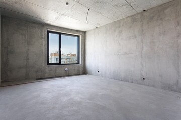 interior of the apartment without decoration in gray colors. rough finish