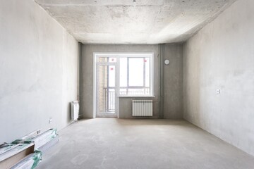 interior of the apartment without decoration in gray colors. rough finish