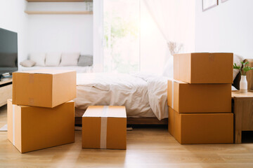 box packaging new home place bedroom. open and close packaging in bedroom concept of relocating or changing home. packaging in bedroom and stuff include bed mattress and blanket for moving in places