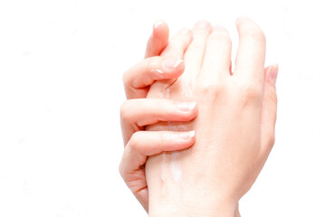 Young woman applying hand cream on white background. Concept of relaxation and self-care