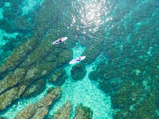 Aerial Tranquility, Kayak Floating on Crystal Waters by the Seashore in Taiwan