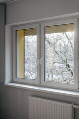 Metal-plastic frame for a pvc window over central heating radiator