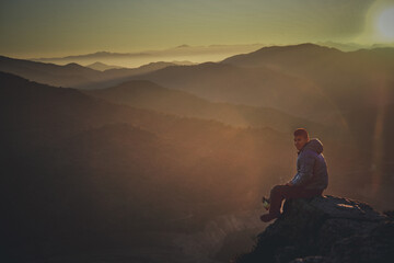 happy person at sunset in the mountain 