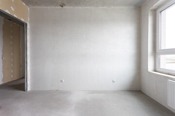 interior of the apartment without decoration in gray colors. rough finish